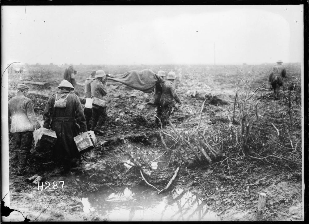 German prisoners carrying wounded at Spice Farm on the Ypres Salient, 4 October 1917